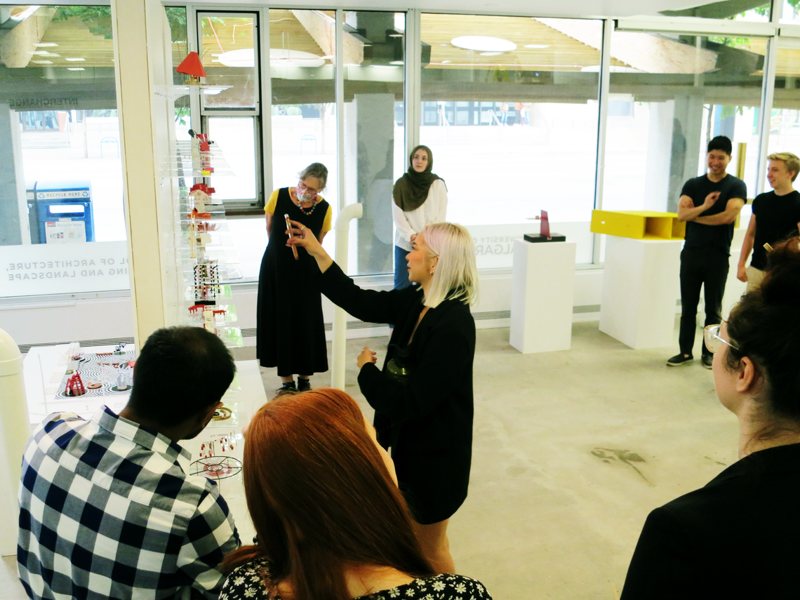 UCalgary student Vivian Ton helps conduct an exhibit tour. 